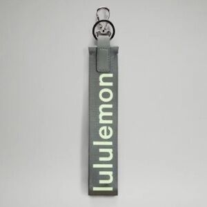 lululemon never lost keychain gray sage/faded zap